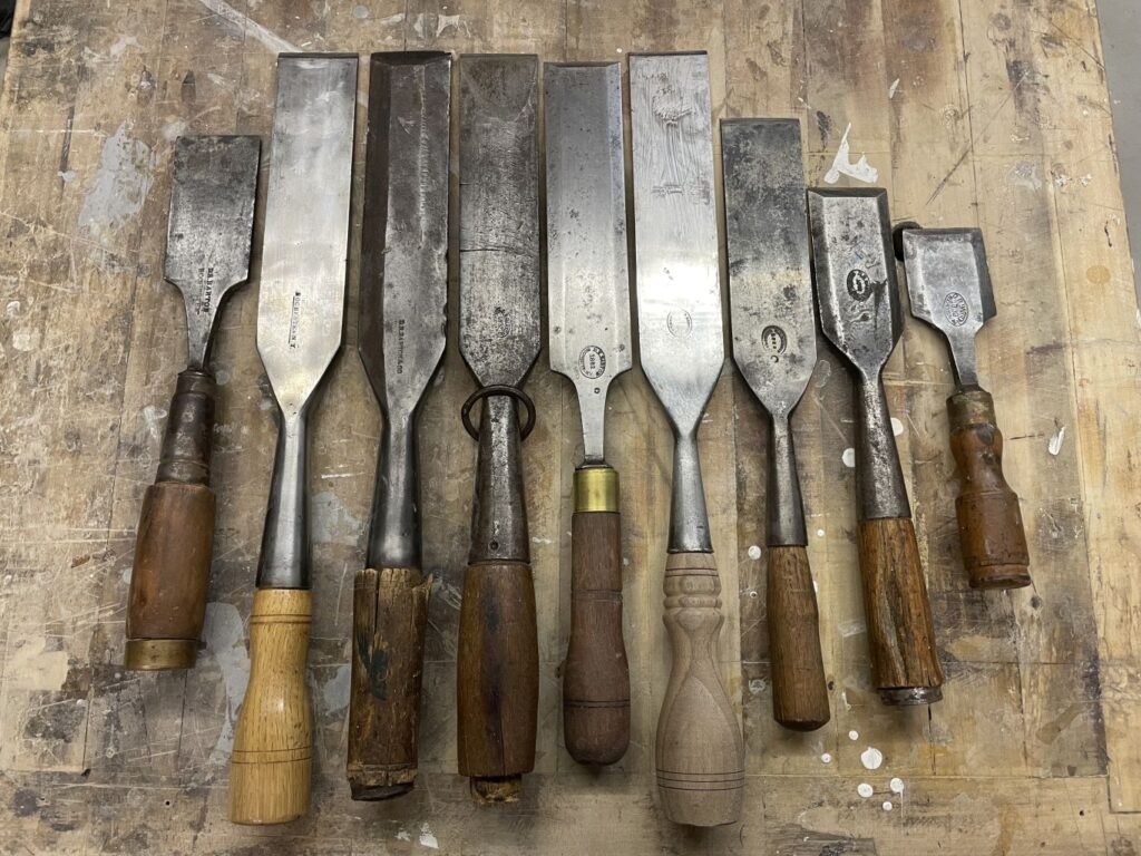 Nine chisels all 2-inch wide